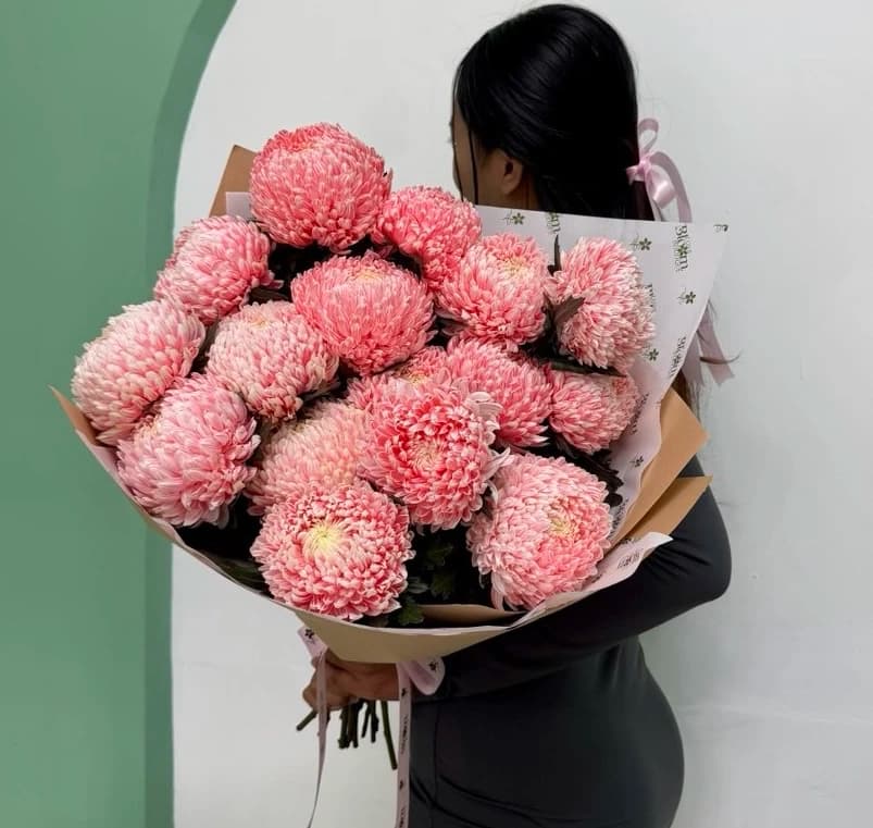 A radiant display of oversized pink chrysanthemums to brighten any moment.